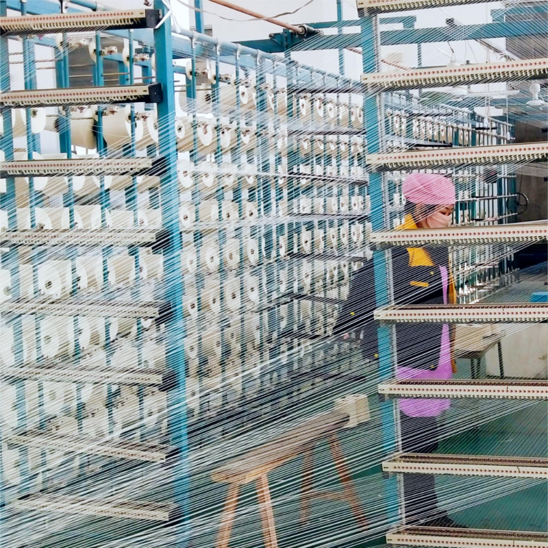 Detailed view of high-precision warping process for high-quality hotel textile manufacturing.jpg
