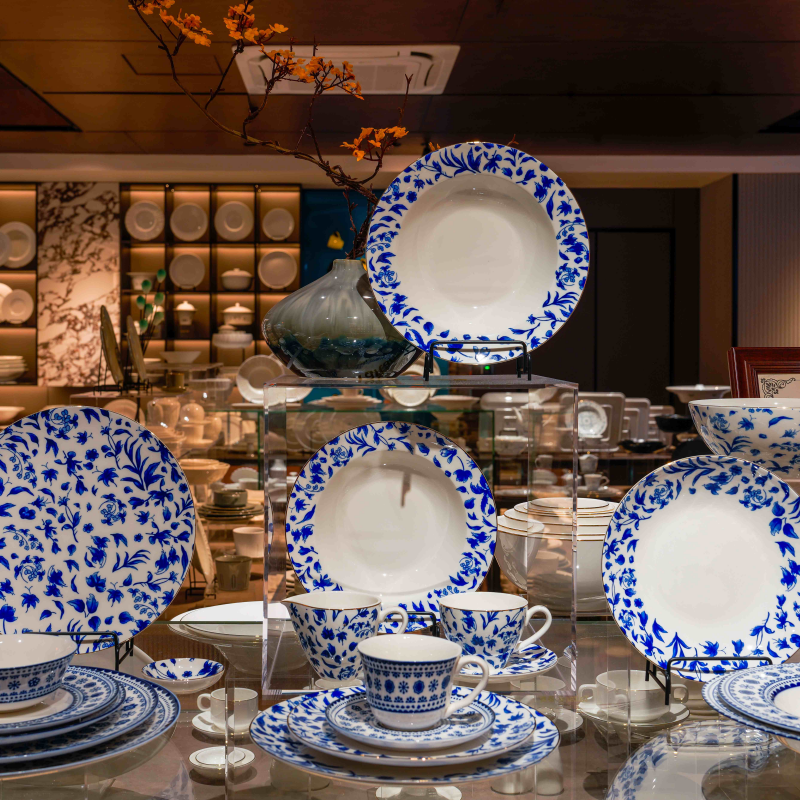 Premium wholesale hotel tableware showroom display showcasing classic blue and white patterned commercial porcelain dinnerware sets and teacups.jpg
