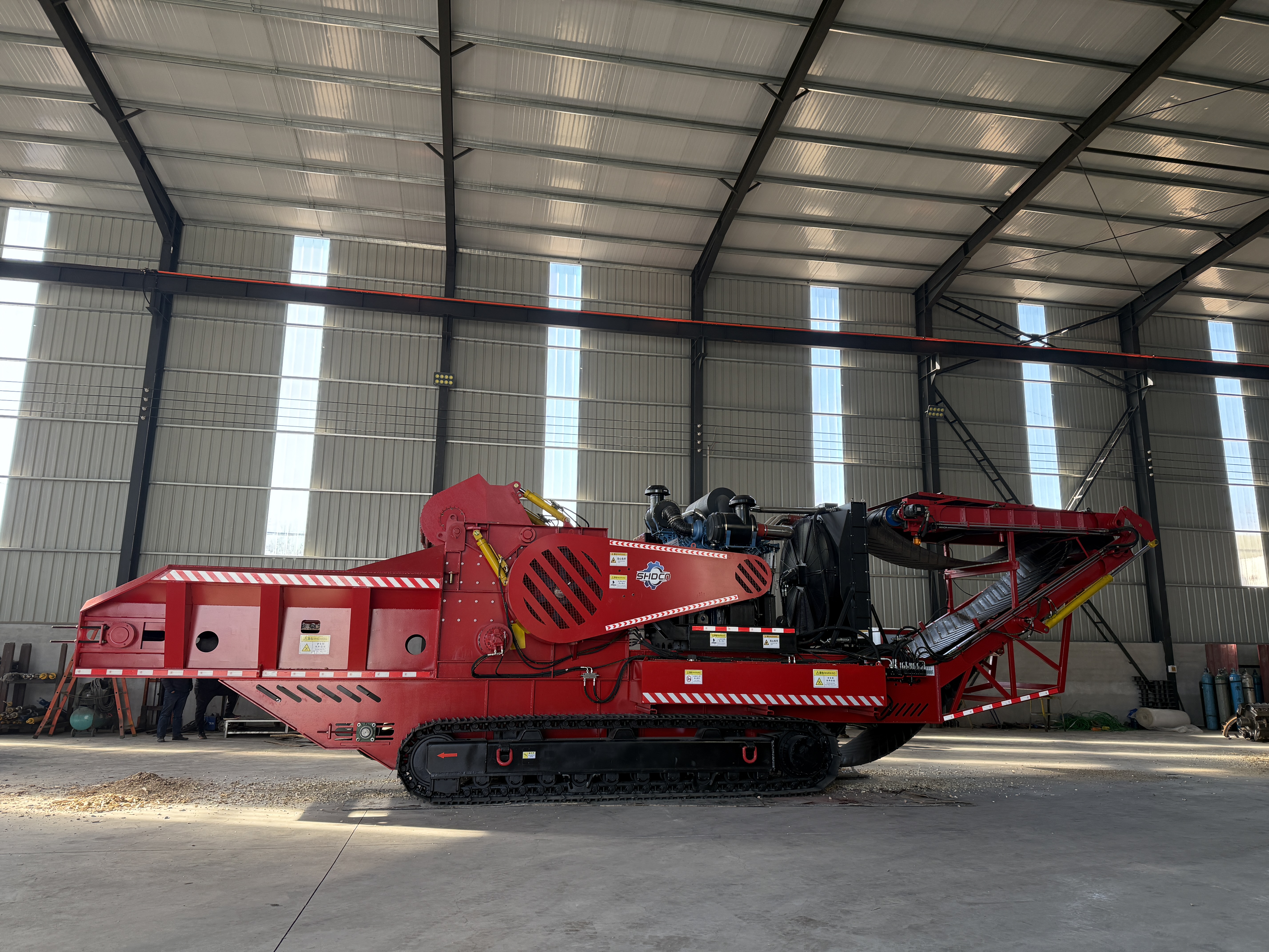 What maintenance work is needed for a horizontal grinder regularly?