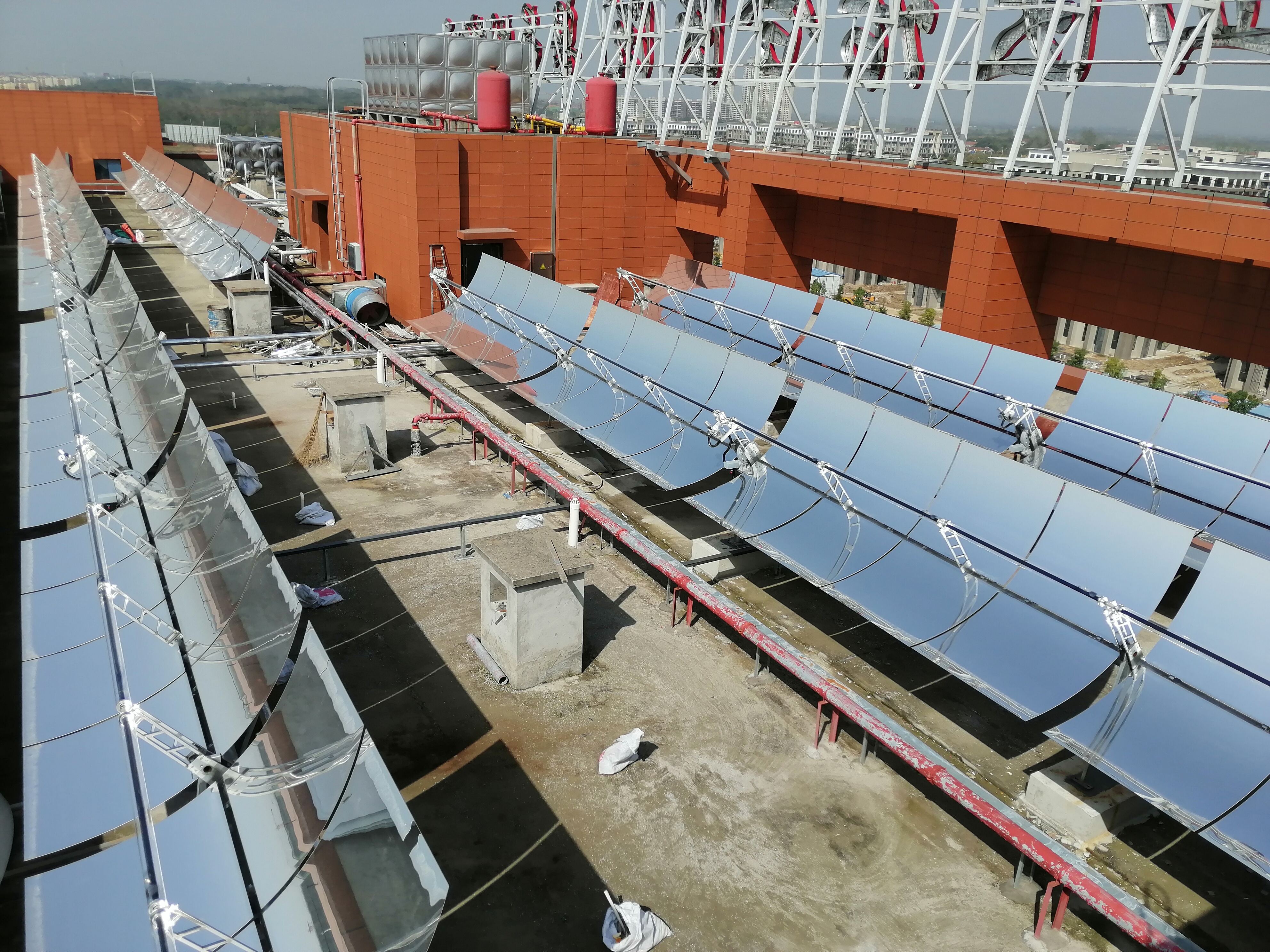 Parabolic trough systems use long, curved mirrors to concentrate sunlight onto a receiver tube running along their focal line. A heat transfer fluid4.jpg