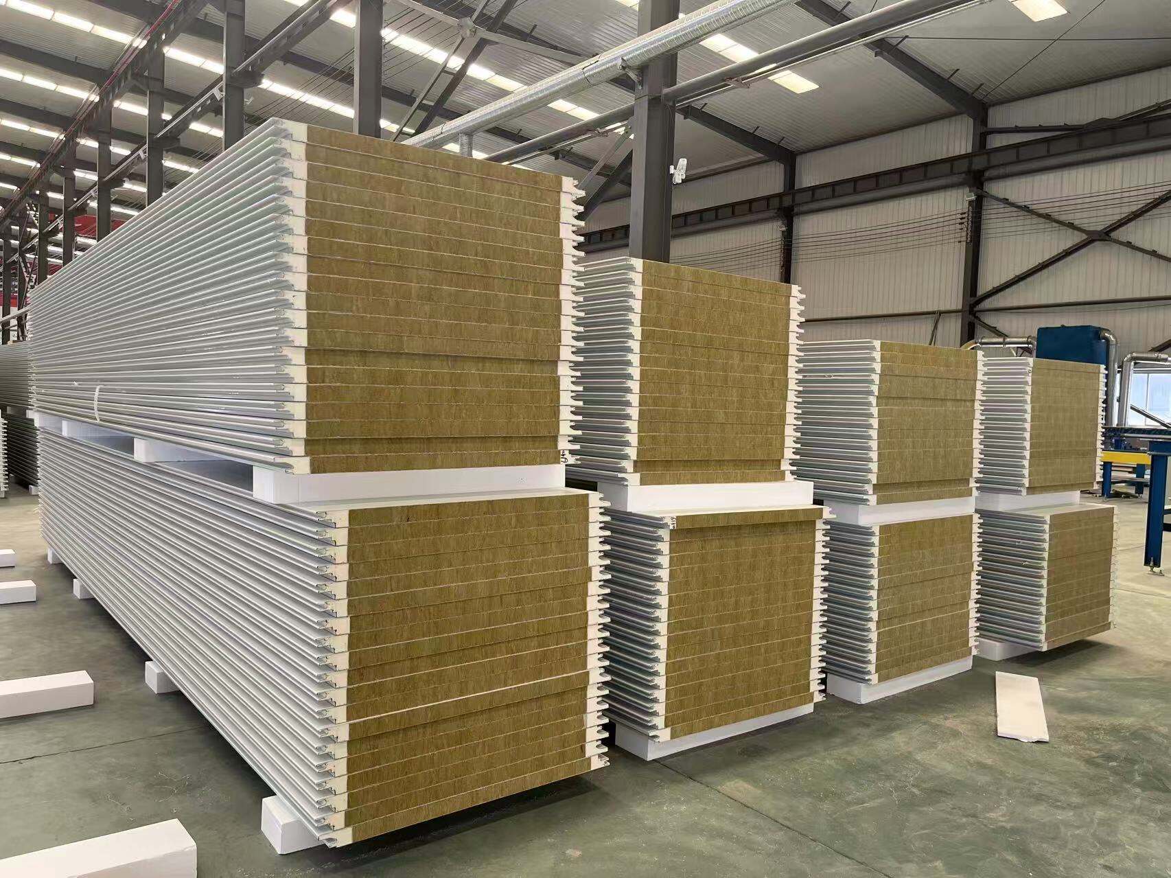 What advantages does rock wool as core material bring to sandwich panels?
