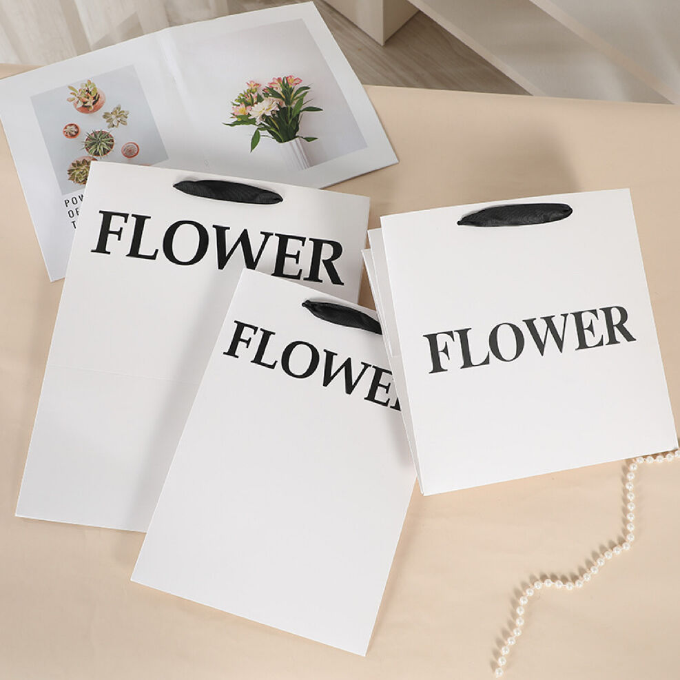 What are the durability advantages of using premium paper bags for retail luxury goods?