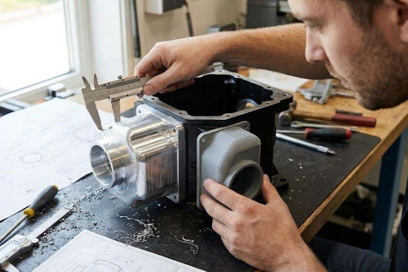 Comparison between CNC machined prototypes and 3D printed prototypes highlighting fit and functional accuracy