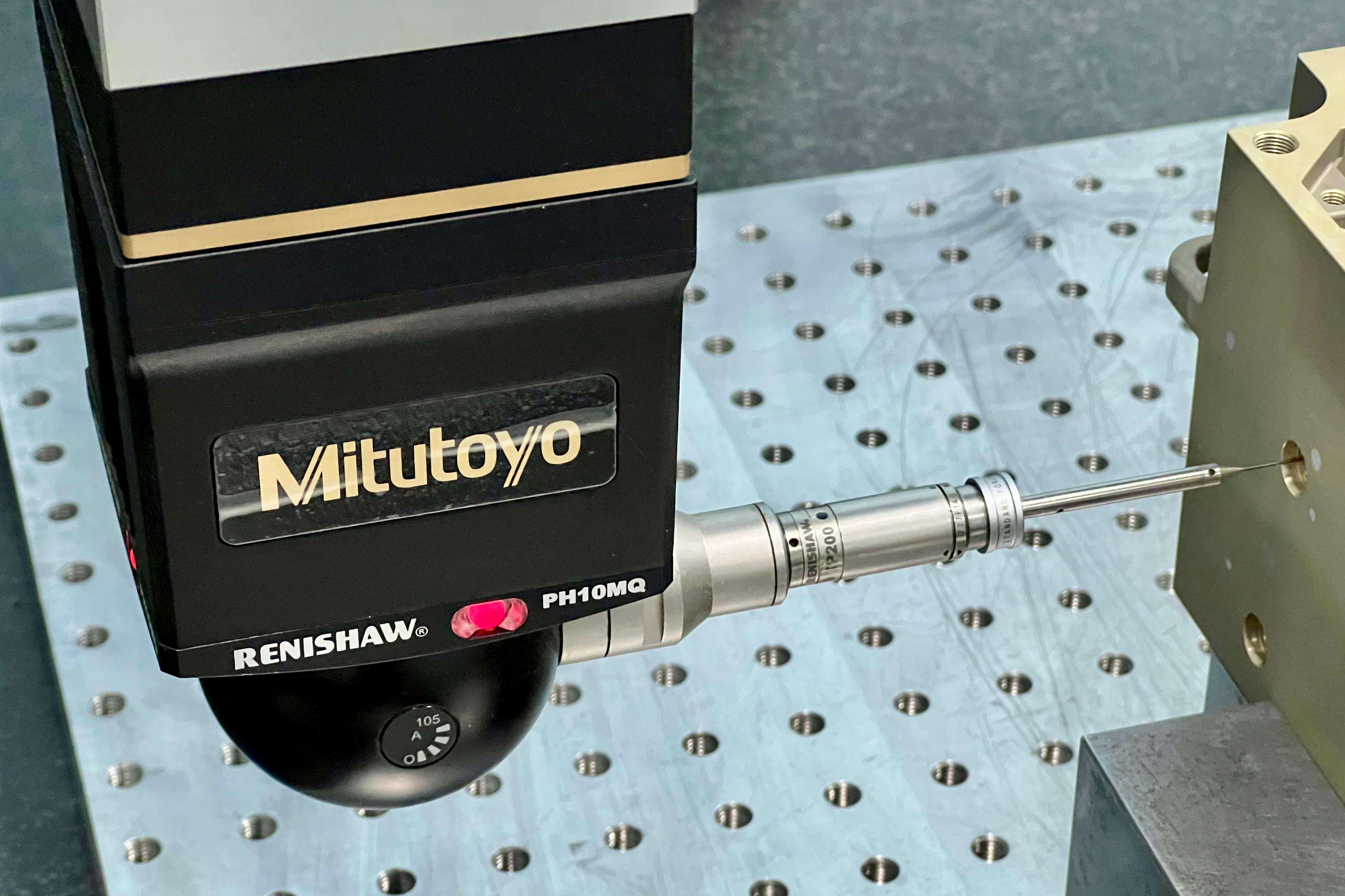 Precision measurement of CNC-machined gear showing ±0.005mm tolerance with CAD blueprint overlay