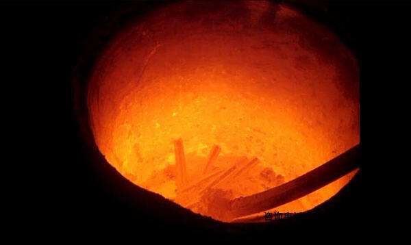 Technician monitoring molten aluminum temperature for process efficiency