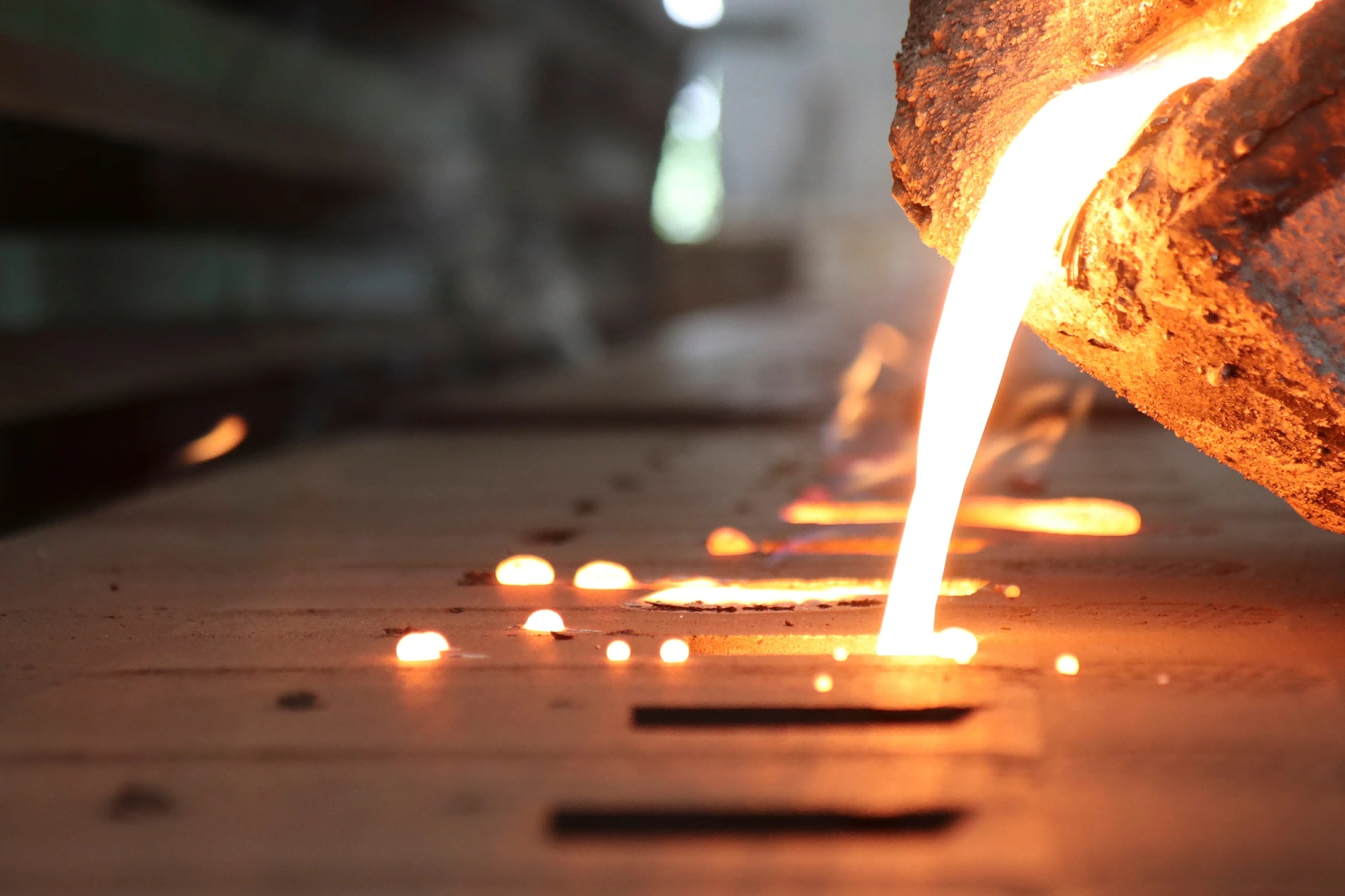 Molten aluminum alloy poured into mold cavity during aluminum casting process