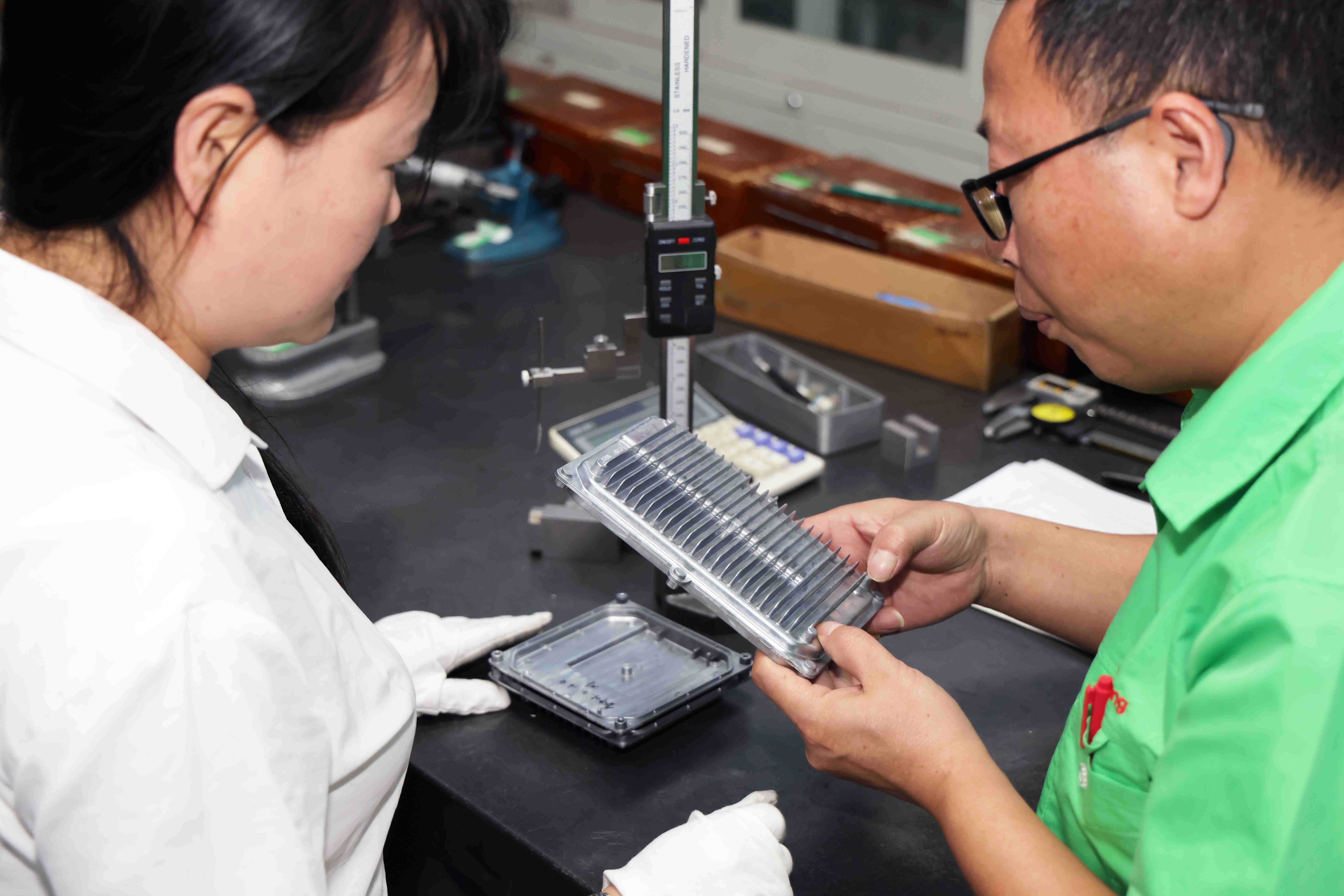 technician checking part quality