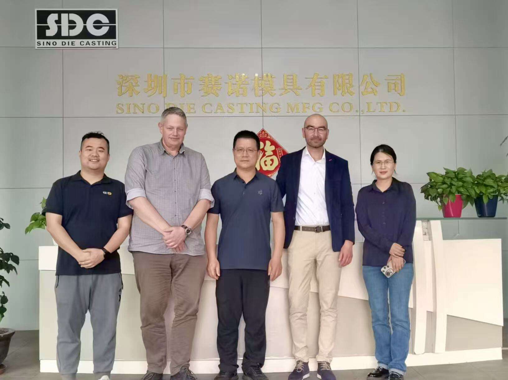 Engineering and business team discussing integrated manufacturing partnerships in die casting industry