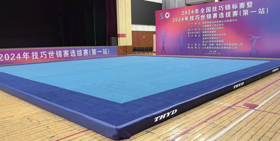 How do you select a gymnastics mat for high-intensity training centers?