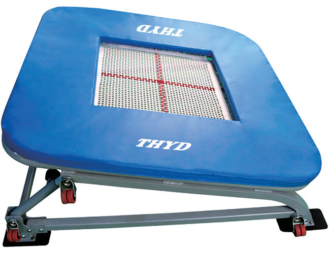 How does an incline trampoline assist skill transition in gymnastics training?