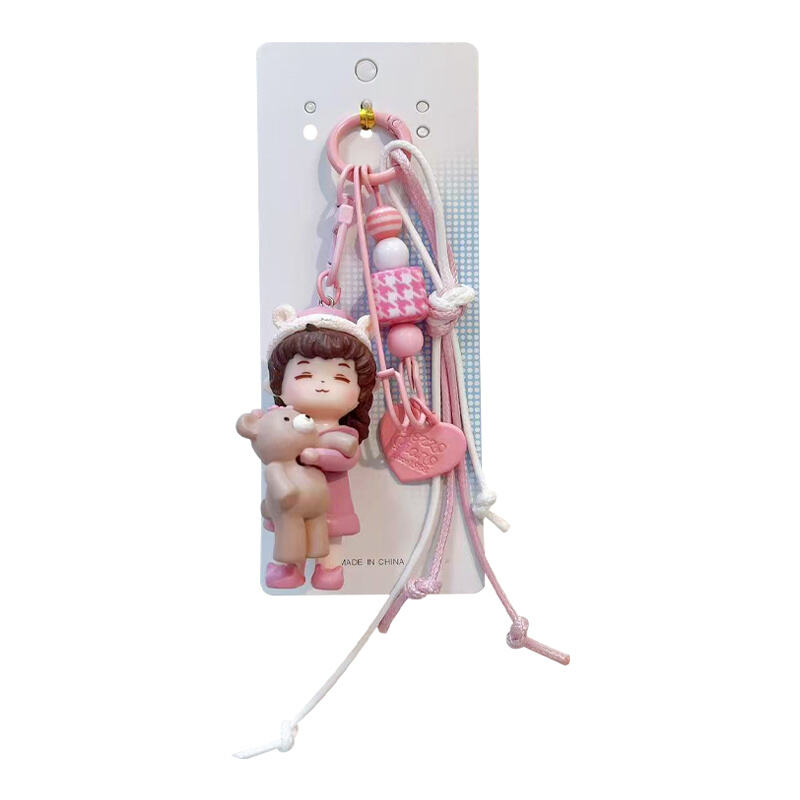 Matching Couple Keychain Set – Bear-Hugging Doll Charm (Blue & Pink)