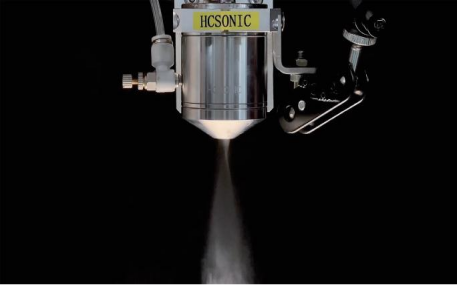 Ultrasonic vortex atomizing nozzle