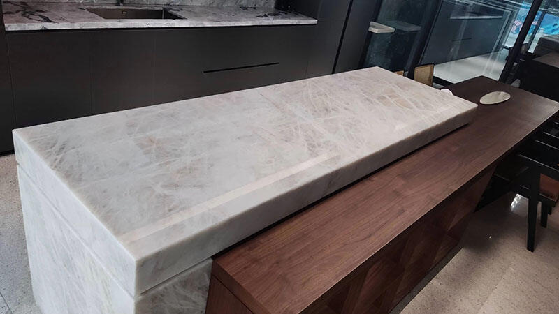 The soft light reflection on a polished Taj Mahal Quartzite island countertop.jpg