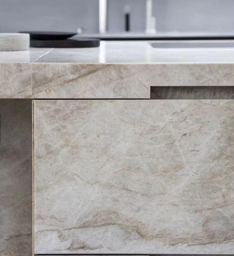 Close-up texture of Taj Mahal Quartzite showing ivory tones and subtle gold veining.jpg