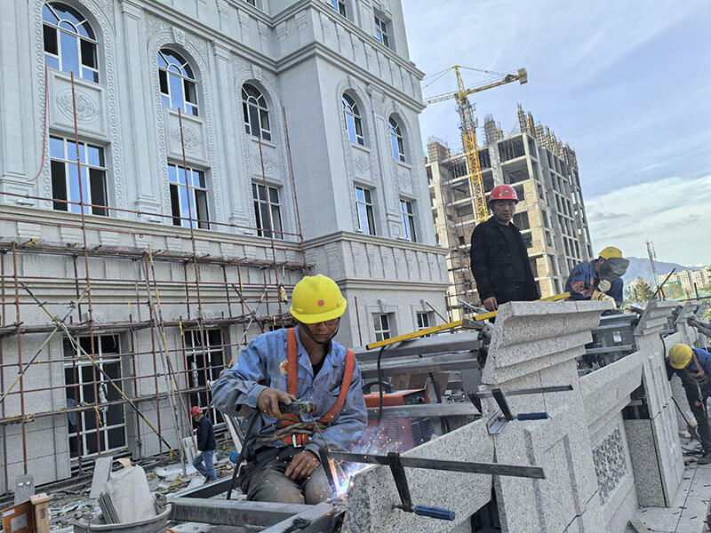 On-site installation of custom stone components for Tajikistan Government Office Building facade, supplied by our stone supplier.jpg