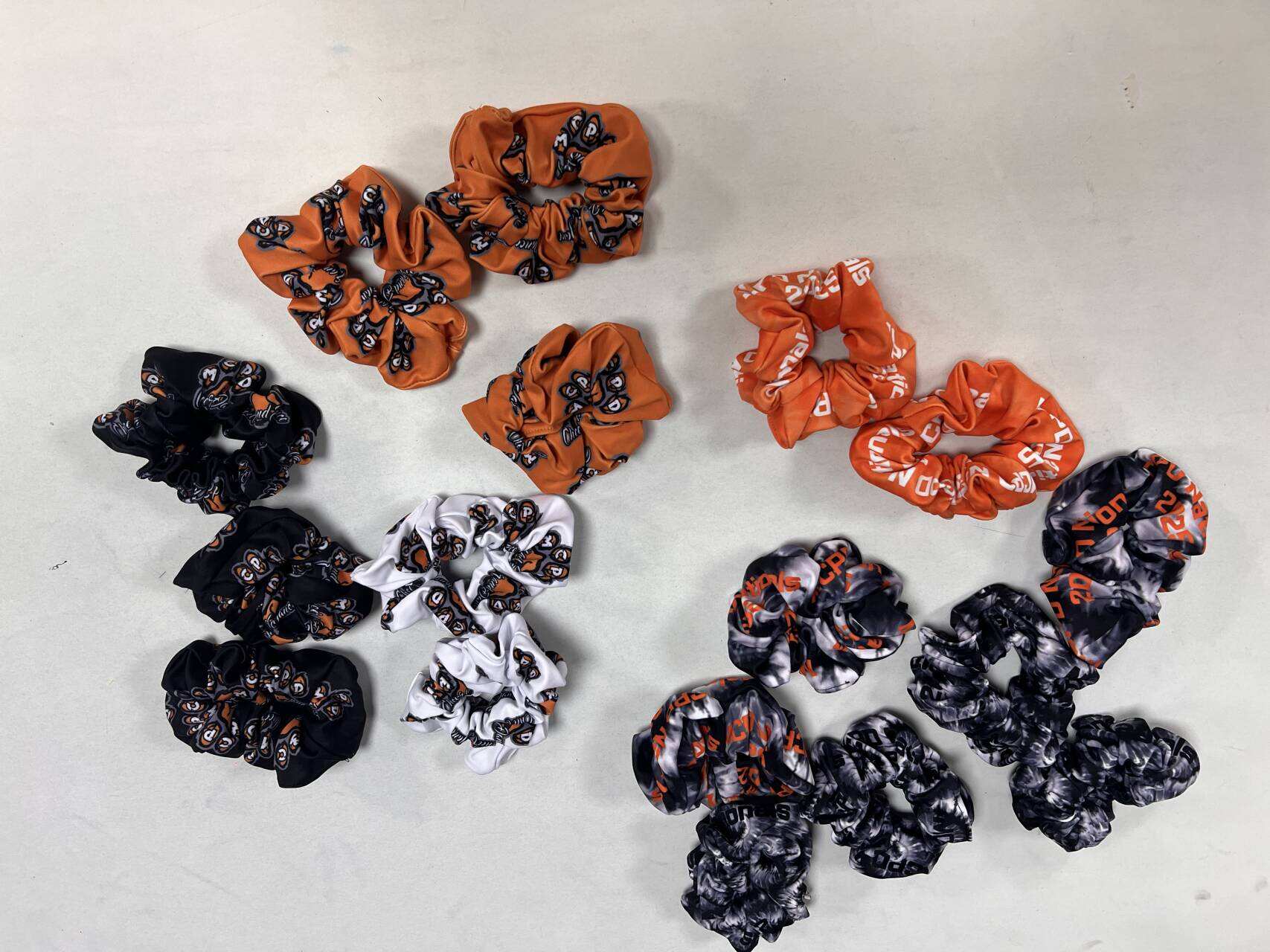 Stand out with our variety of trendy colors and designs in satin scrunchies