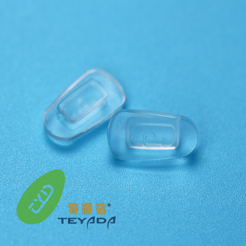 Almohadilla nasal G-547 en forma de lágrima, con botón ascendente