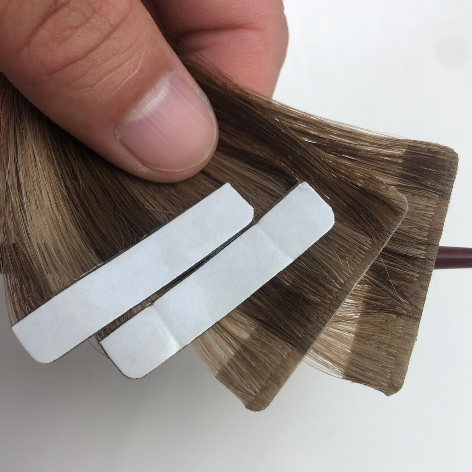 What Makes Custom Seamless Tape-In Hair Extensions a Must-Have for Salons?