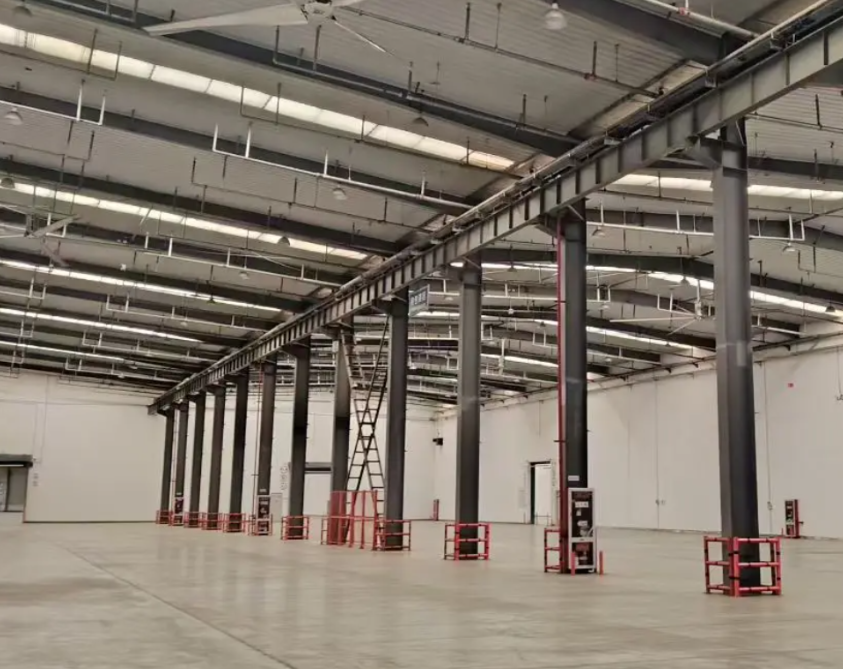 The function of purlins in supporting roof decks and walls.