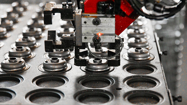 material selection directly impacts machining costs through raw material price and machinability