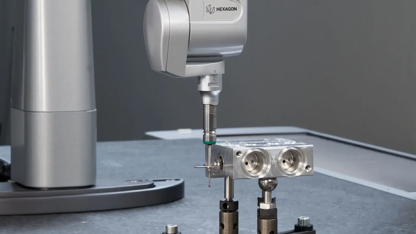cmm probe verifying dimensional accuracy on precision machined components