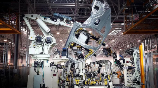 modern fiber laser system performing precision sheet metal cutting in an industrial fabrication facility