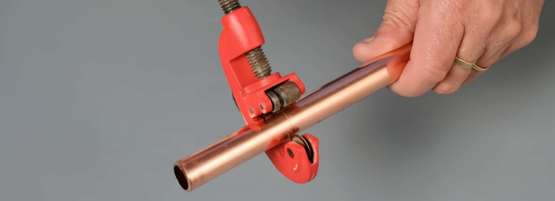 cutting and cleaning copper tubing before assembly