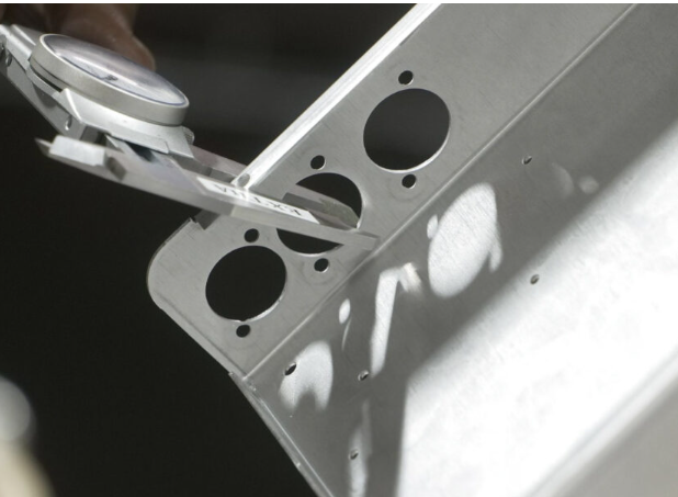 quality inspection process ensuring perforated metal meets precise tolerance specifications
