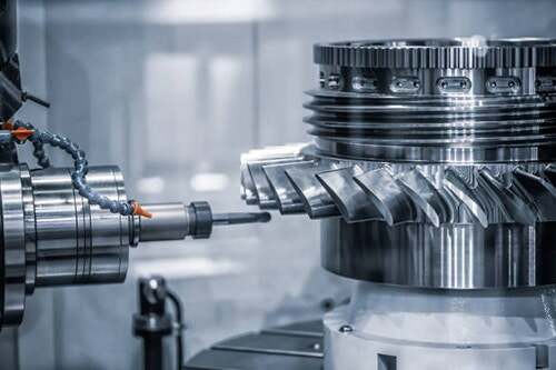 modern cnc machining center producing precision metal components