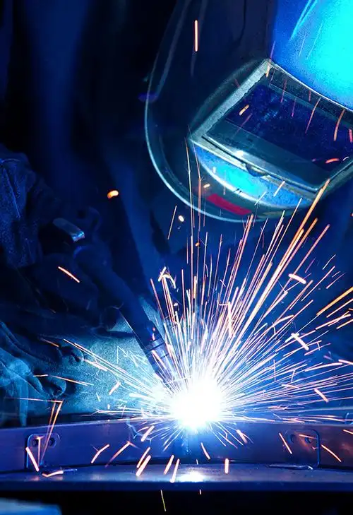 welded steel joint inspected in a modern fabrication shop