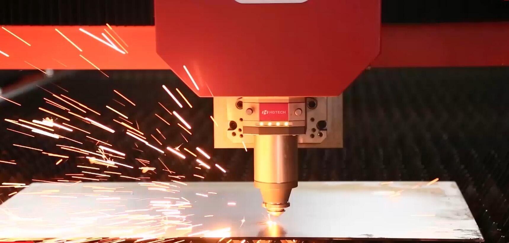 modern fiber laser cutting machine precisely processing sheet metal in an industrial manufacturing facility