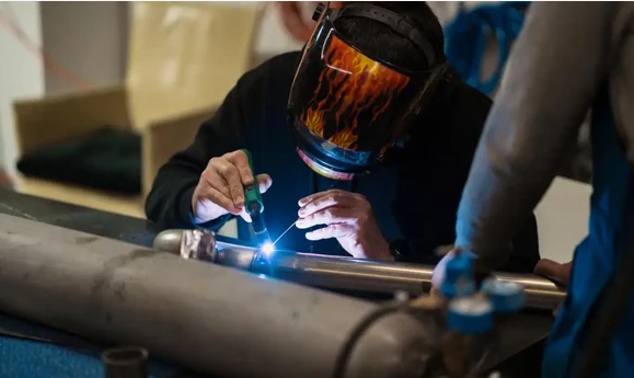 tig precision and gas welding in a controlled shop setting