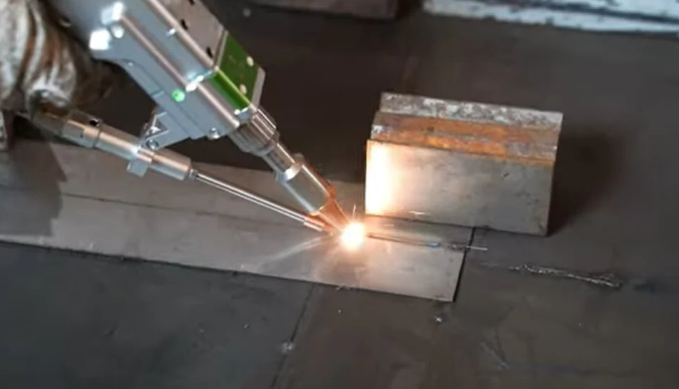 laser welding joining two metal parts with a focused beam