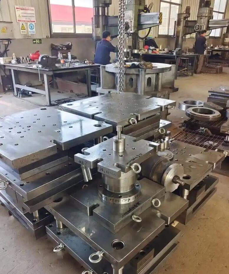 automotive stamping dies produce thousands of identical body panels daily with precision tolerances