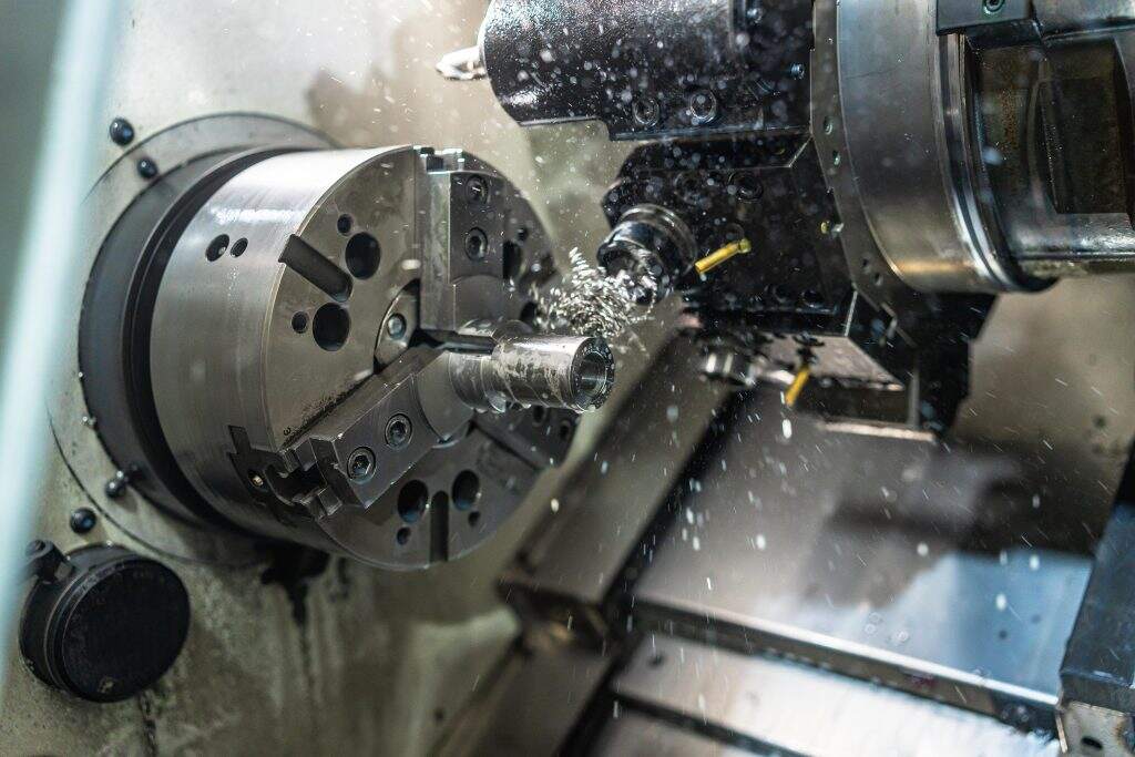 cnc milling uses rotating tools on stationary workpieces while turning rotates the material itself