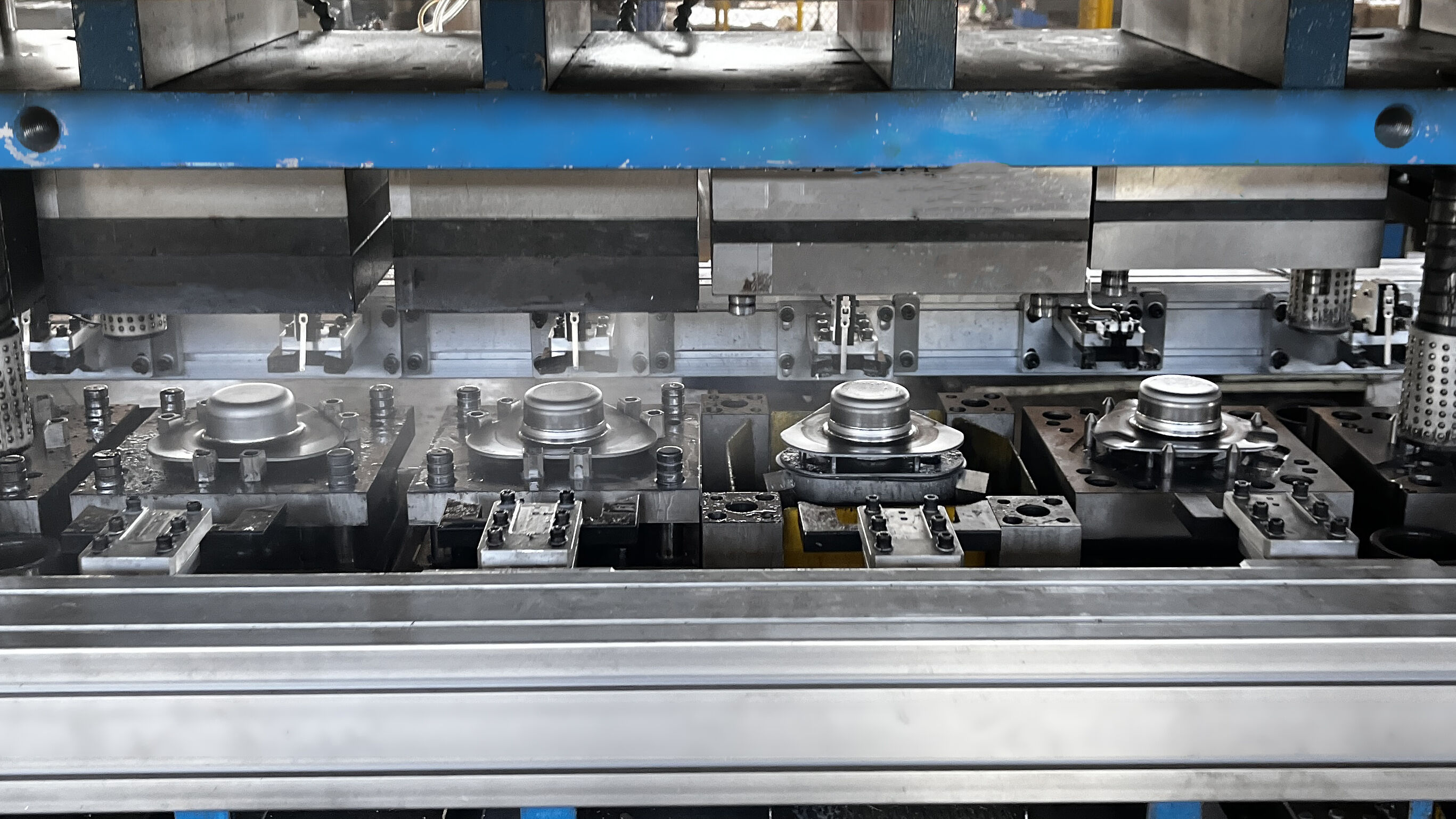 progressive die performing multiple stamping operations in sequence