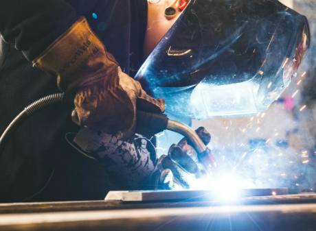 the main components of a mig welding setup shown in one clear workshop scene