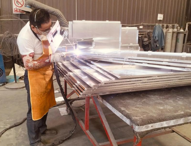 custom stainless sheet metal fabrication facility with precision cutting equipment