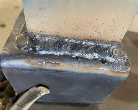 inspecting a weld bead after slag removal