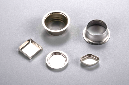 multiple stamping operations combine to create complex part geometries from flat sheet metal