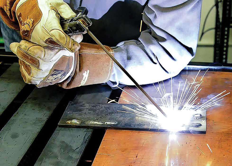 a stick welding arc melts the electrode and base metal to form a weld bead