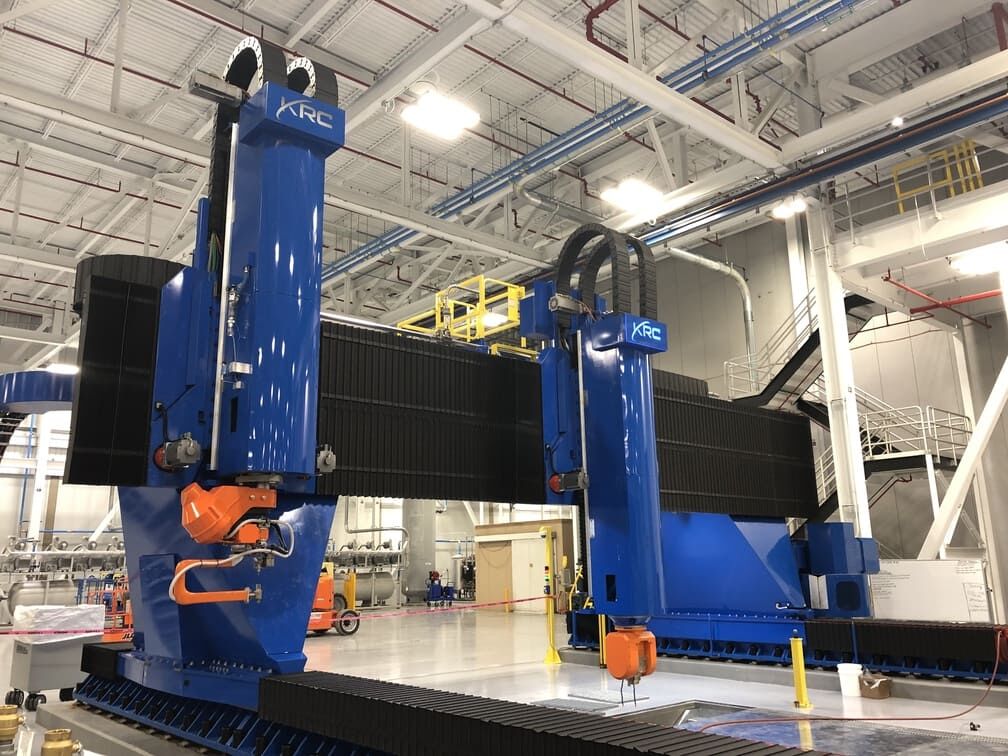 large gantry cnc machine processing an oversized aerospace component