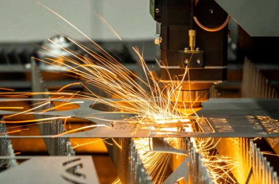 industrial laser cutting machine precisely cutting sheet metal in a modern manufacturing facility