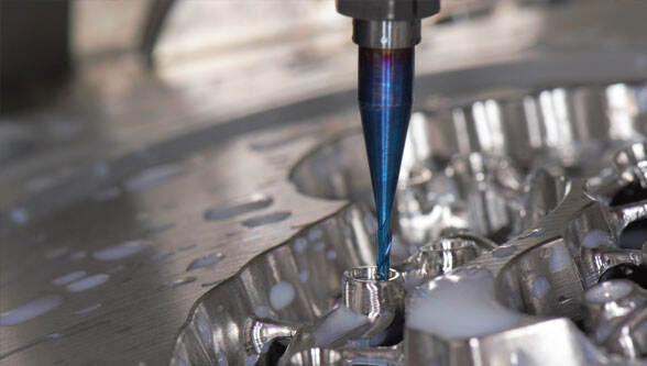 carbide cutting tool machining aluminum with metal chips in motion