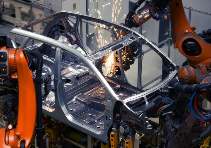 illustration of robotic welding in automotive chassis manufacturing