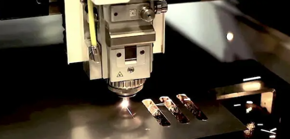 plasma cutting operation on thick steel plate showing precision metal cutting