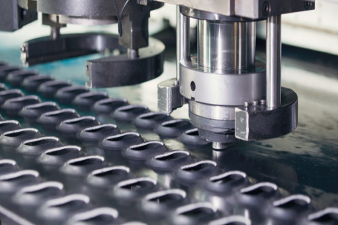 industrial punch press system creating precise perforations through die perforation manufacturing