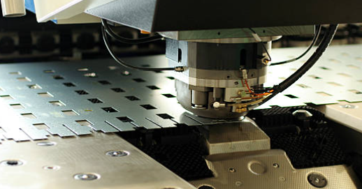 close examination of punched hole edge quality showing proper shear characteristics
