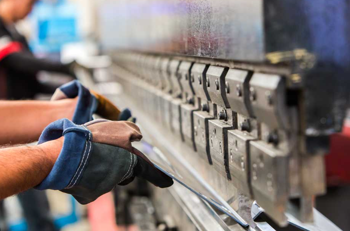 press brake machine performing precision metal bending in an industrial fabrication facility