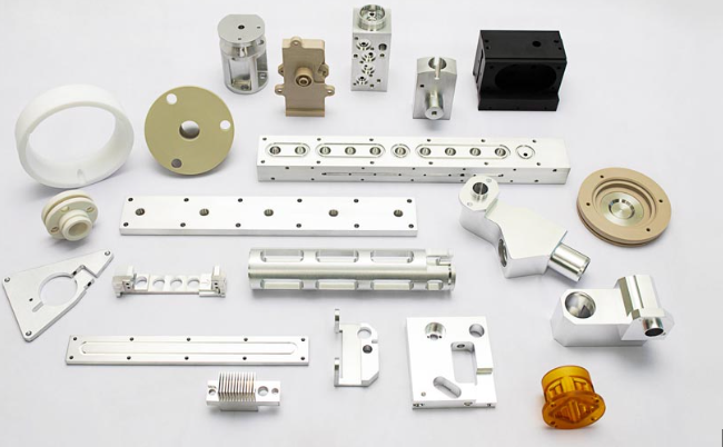 engineering team reviewing prototype sheet metal components during new product development